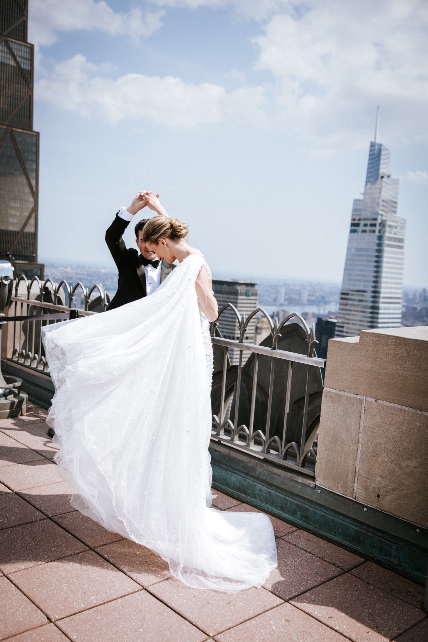 Bride spinning her gown on the terrace at Top of the Rock