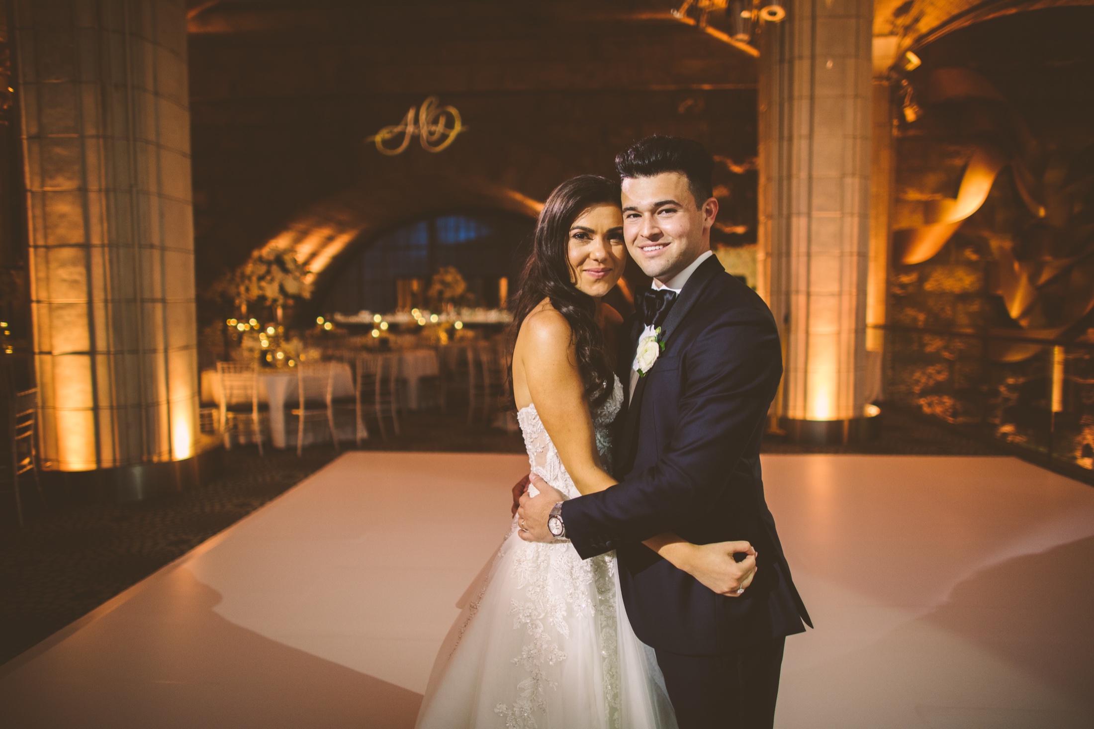 Couple on the dance floor beneath the amber-lit tiled vaults at Guastavino's