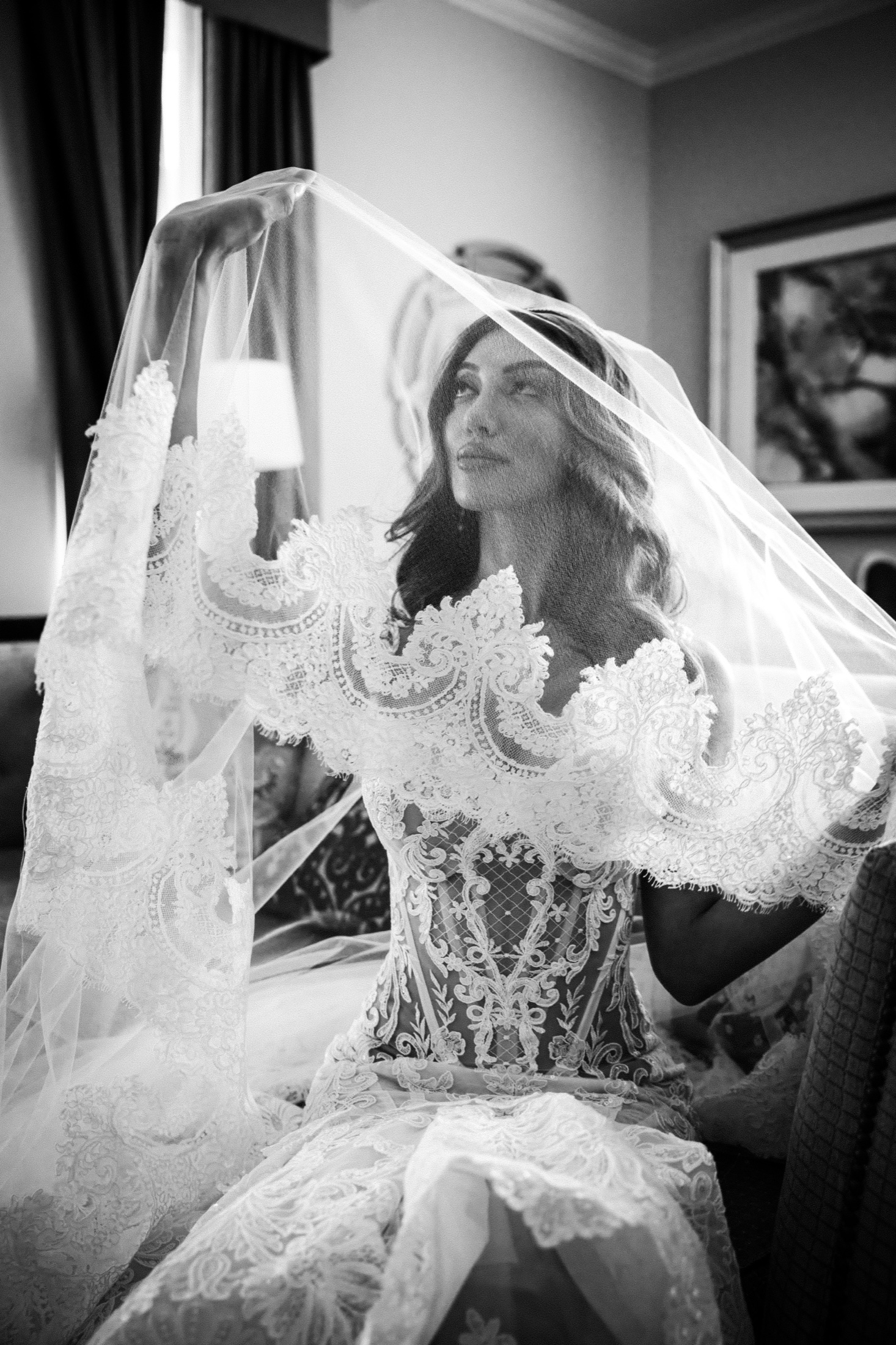 Black and white portrait of a bride beneath her veil