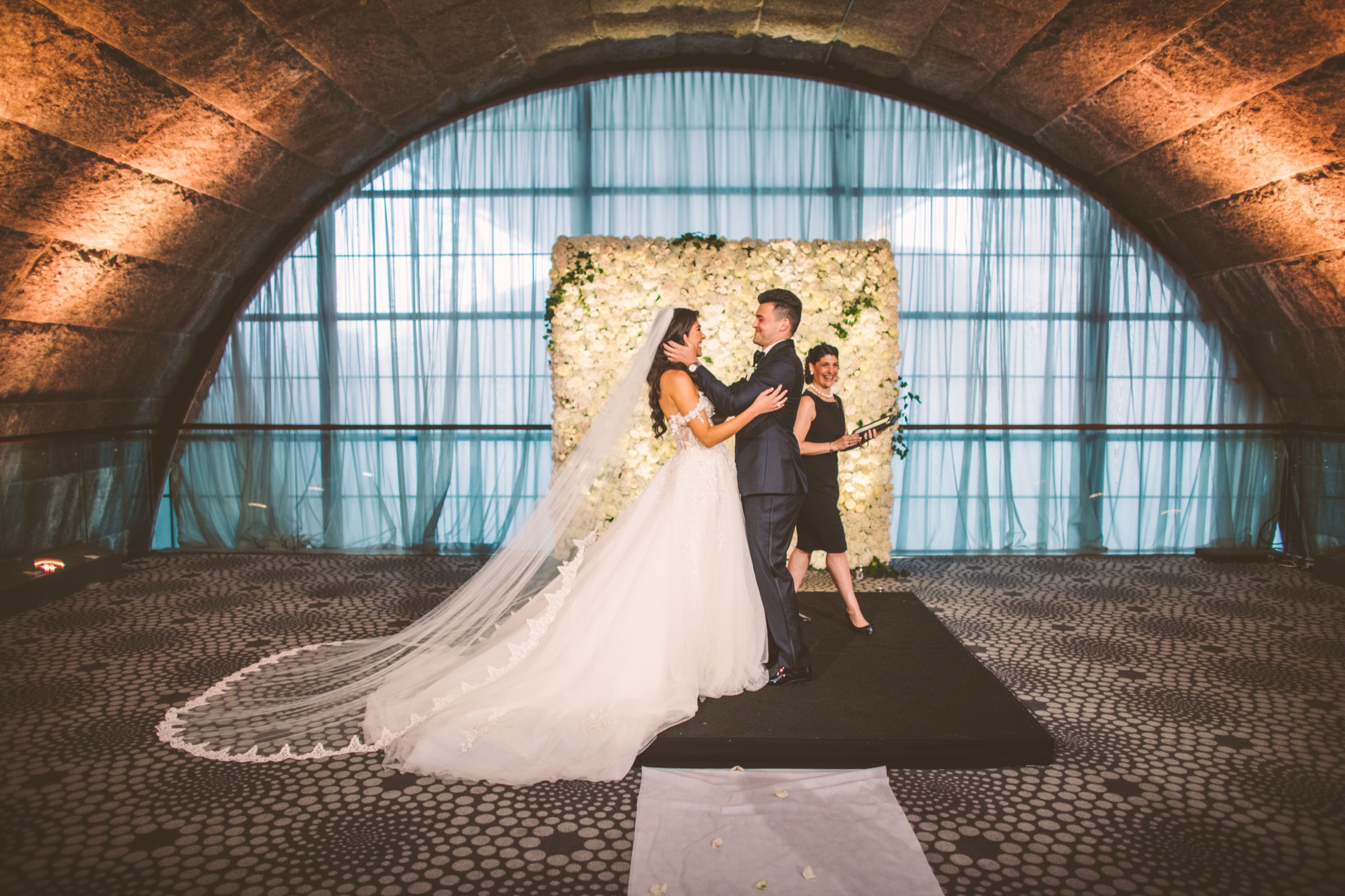 Ceremony beneath the grand arched window at Guastavino's